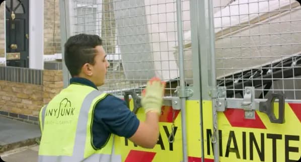 Service partner loading waste into a truck